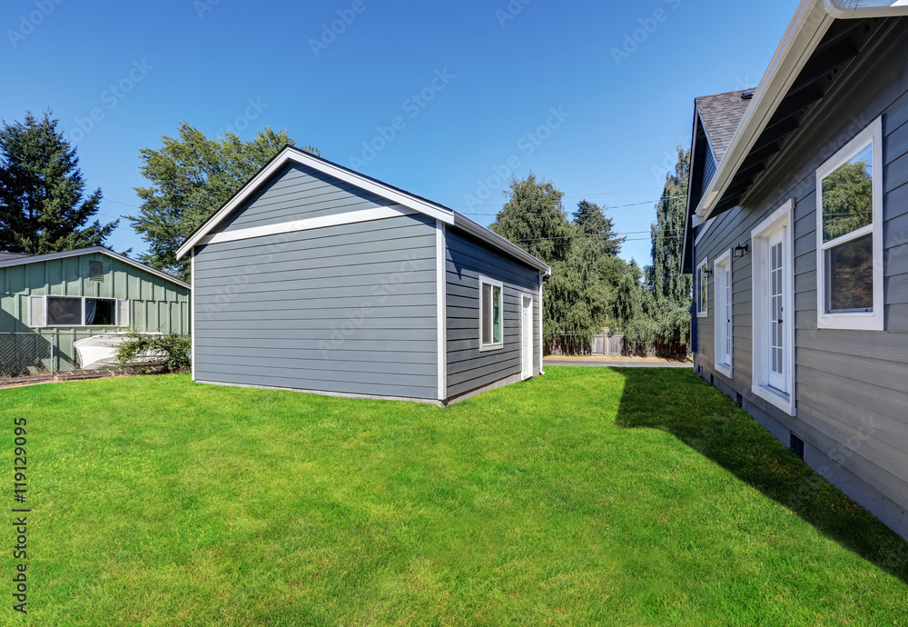 Blue siding house with matching detached garage Blue siding house with matching detached garage