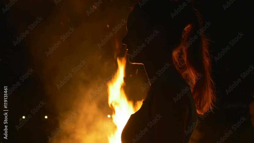 Profile of a woman on a background of a fire Profile of a woman on a background of a fire