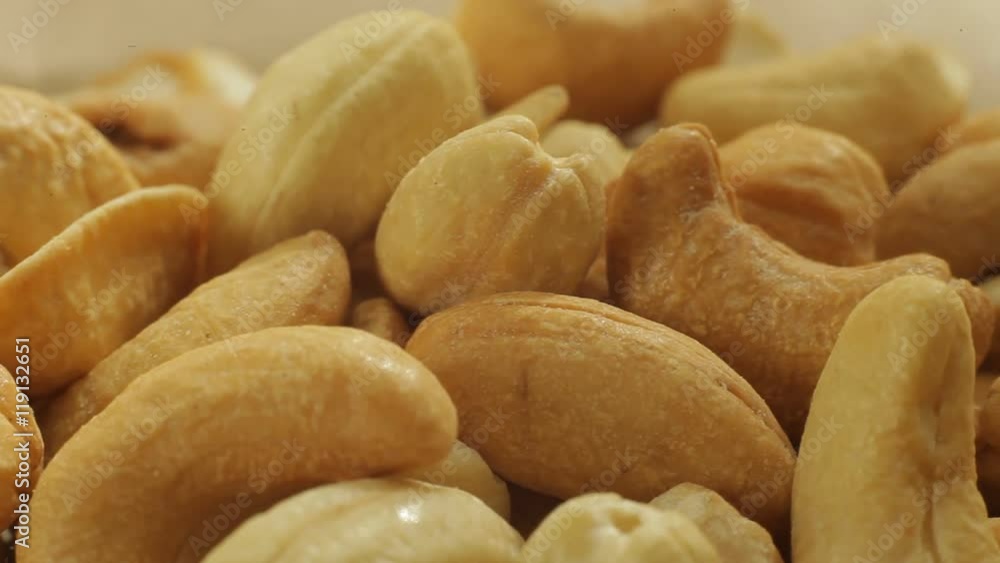 Cashew nuts background close-up slow panorama. Macro. Dolly shot. Cashew nuts background close-up slow panorama. Macro. Dolly shot.