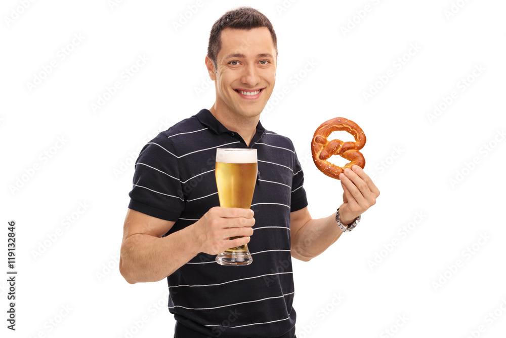 Fototapeta premium Man holding a pretzel and a beer
