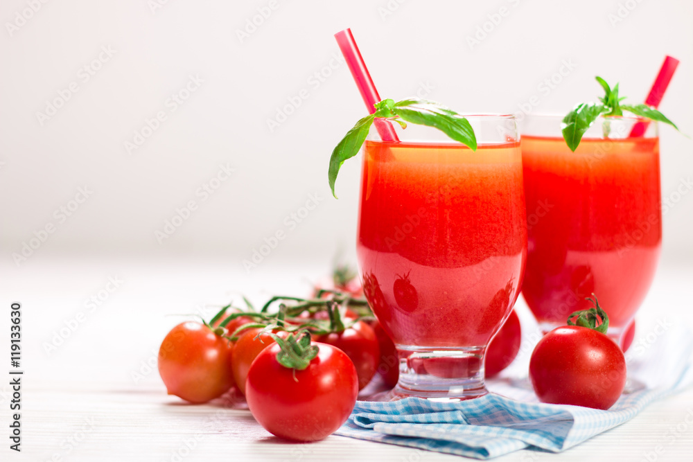 Tomato Juice and Fresh Tomatoes on a White Wooden Background Tomato Juice and Fresh Tomatoes on a White Wooden Background
