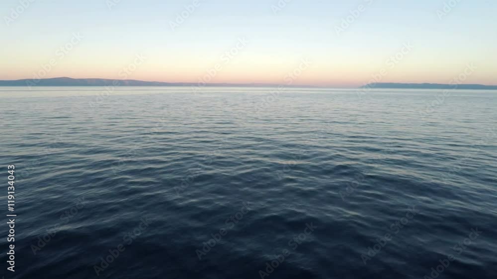 Landscape scene of sunrise on calm blue Adriatic sea Landscape scene of sunrise on calm blue Adriatic sea