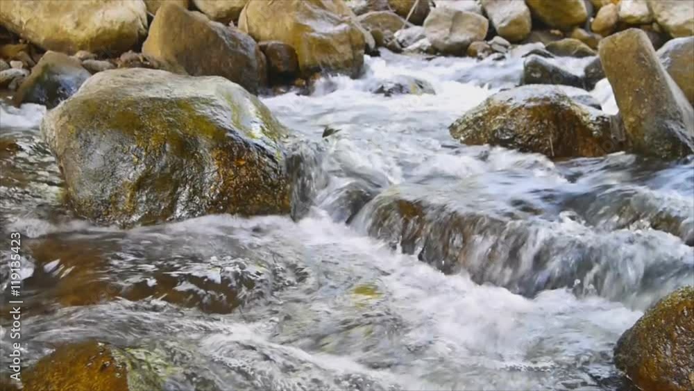 Big rock in canal, water way from waterfall,Thailand Big rock in canal, water way from waterfall,Thailand