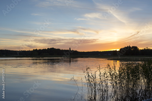 Colorful evening by the lake in Finland. An image of a beautiful sunset on a summer night. © Jne Valokuvaus