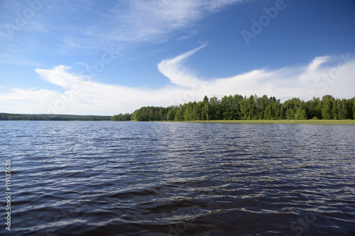Lake view in the country side on a sunny day. Image taken in Finland.