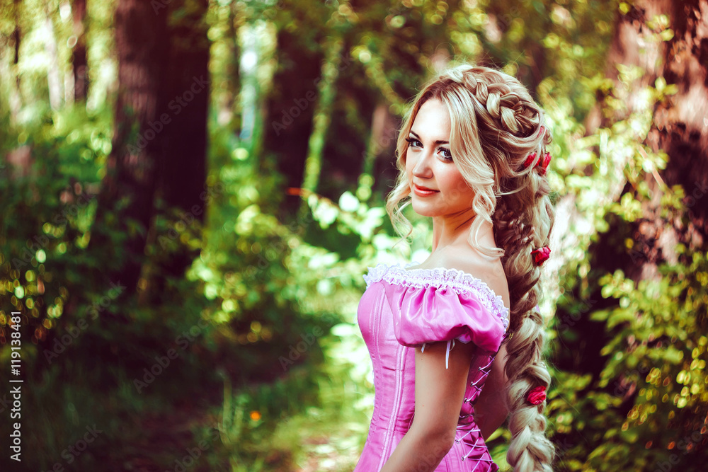 Beautiful girl with long hair braided in a braid, in corset and magnificent pink dress. Beautiful girl with long hair braided in a braid, in corset and magnificent pink dress.