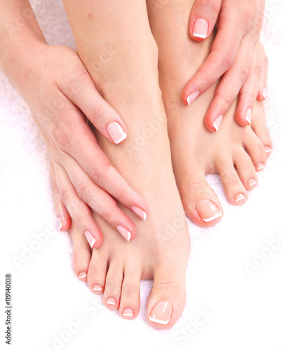 pedicure on legs and beautiful manicure  hands closeup