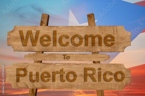 Welcome to Peurto Rico sign on wood background with blending national flag photo