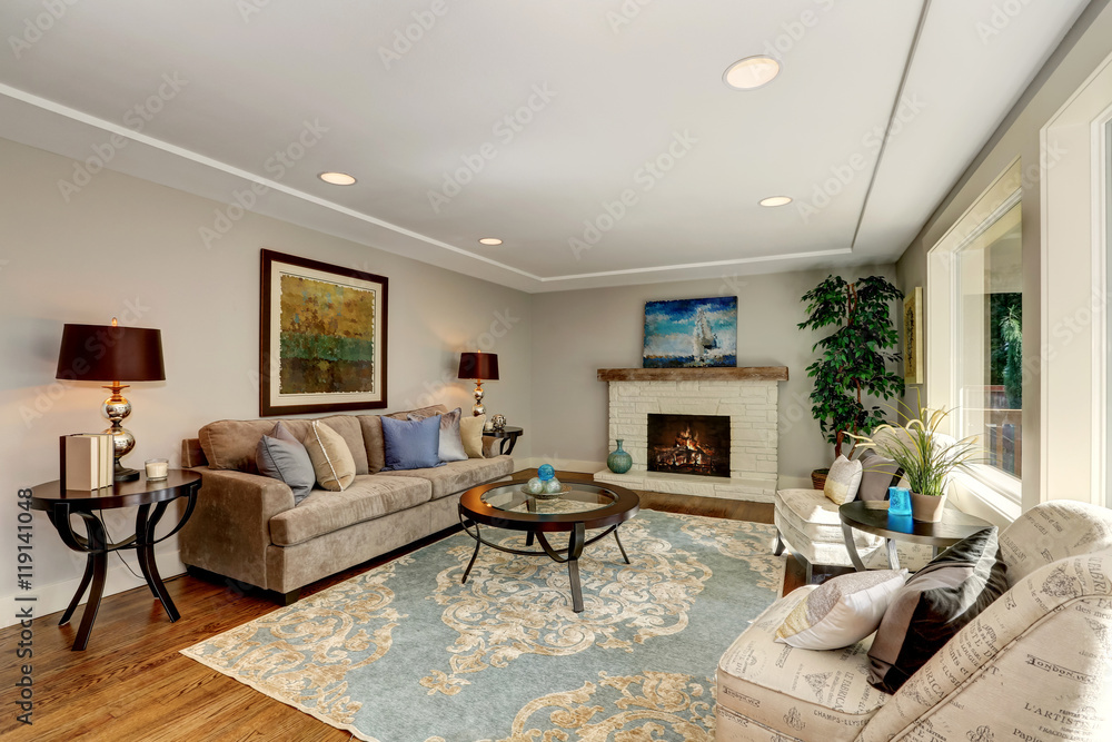 Fototapeta premium Cozy living room interior with hardwood floor and fireplace.