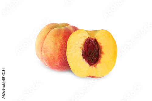 whole and half peach with stone isolated on white background wit