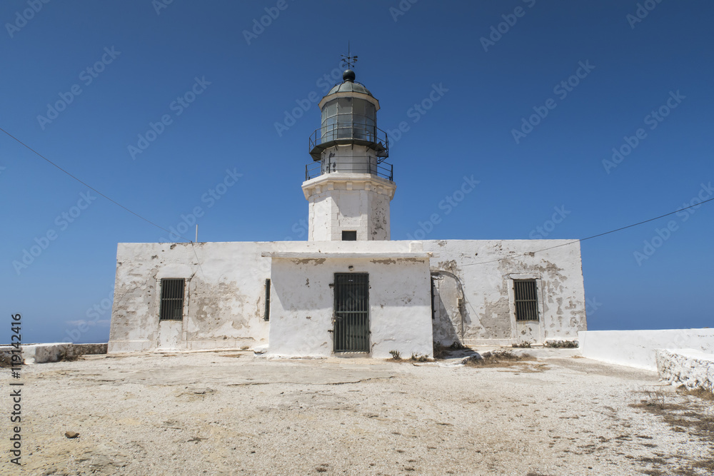 Mykonos island, Greece. Lighthouse Armenistis. The lighthouse, located in Cape Armenistis, was manufactured in 1891 and overlooks the island of Tinos.