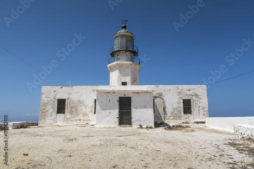 Mykonos island, Greece. Lighthouse Armenistis. The lighthouse, located in Cape Armenistis, was manufactured in 1891 and overlooks the island of Tinos.