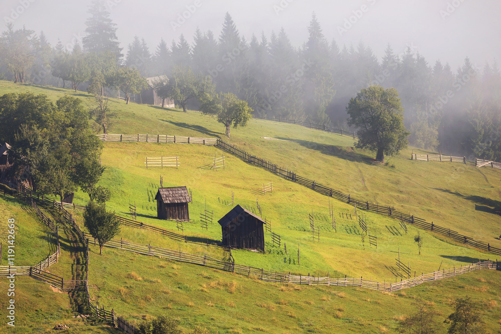 Beautiful foggy morning in the romanian village, in Bucovina Beautiful foggy morning in the romanian village, in Bucovina