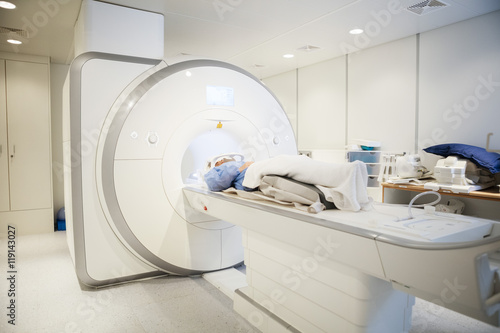 Female Patient Going Through MRI Scan In Hospital