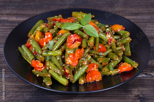 Healthy green beans, red cherry tomato with sesame seeds