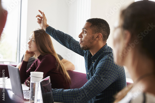 Papier peint Students Asking Question Whilst Attending Lecture On Campus