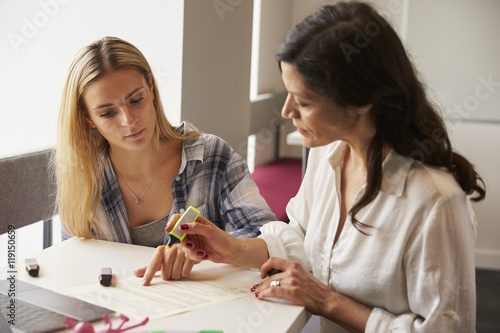 Tutor Using Learning Aids To Help Student With Dyslexia photo