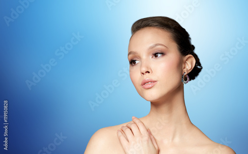 close up of beautiful woman face with earring