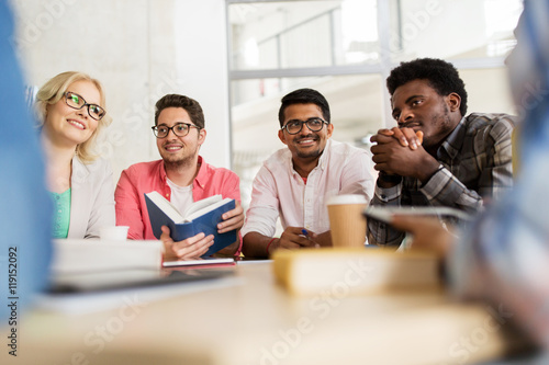 group of high school students sitting at table