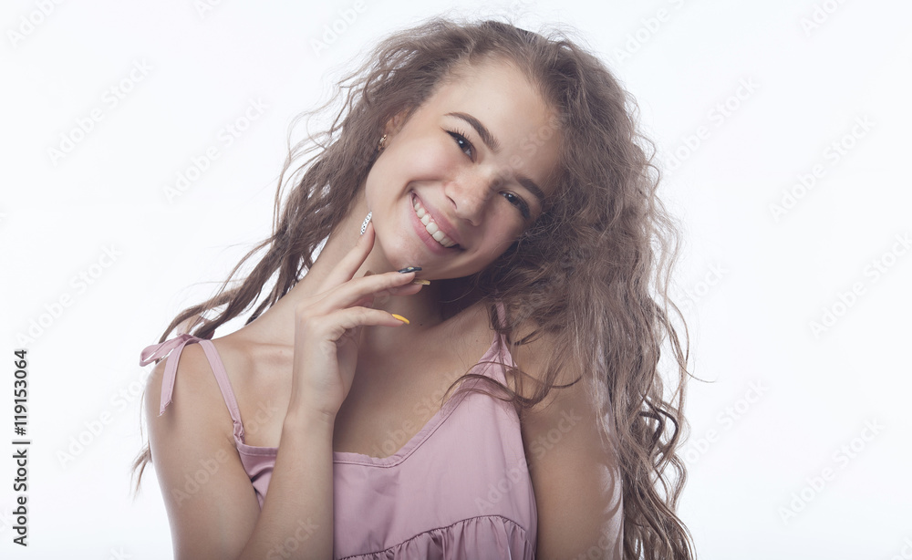 Fototapeta premium portrait of attractive teenager girl smiling in cheerful mood on white background.