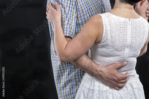 Unrecognized caucasian middle aged couple dancing against black