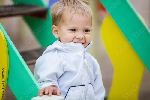 Happy toddler boy on playground