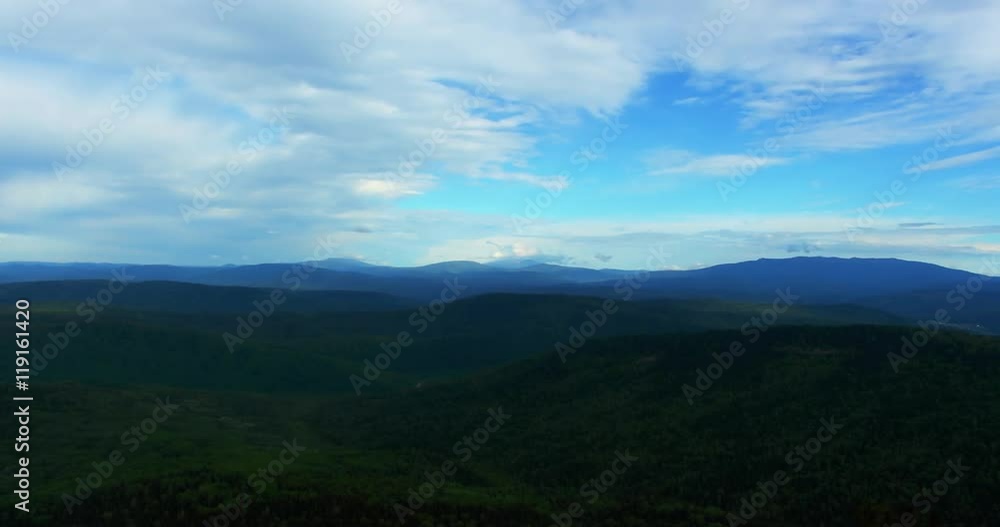 The mountains covered with pine forest/time laps