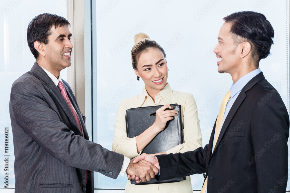Secretary introduces applicant to boss for job interview Secretary introduces applicant to boss for job interview