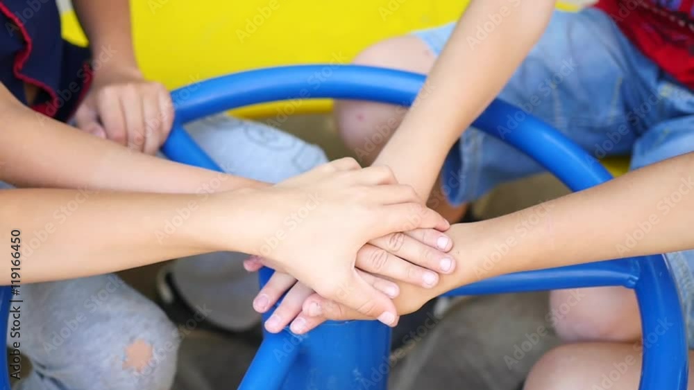 children put the hands together on the Playground children put the hands together on the Playground