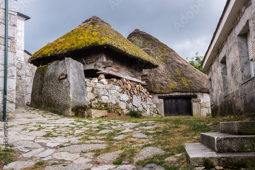 Palloza, traditional thatched roof house in Piornedo, Lugo (Spain) photo