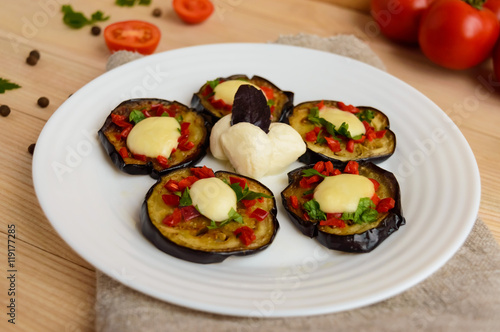 Spicy fried eggplant slices with red pepper, garlic, herbs and mozzarella.