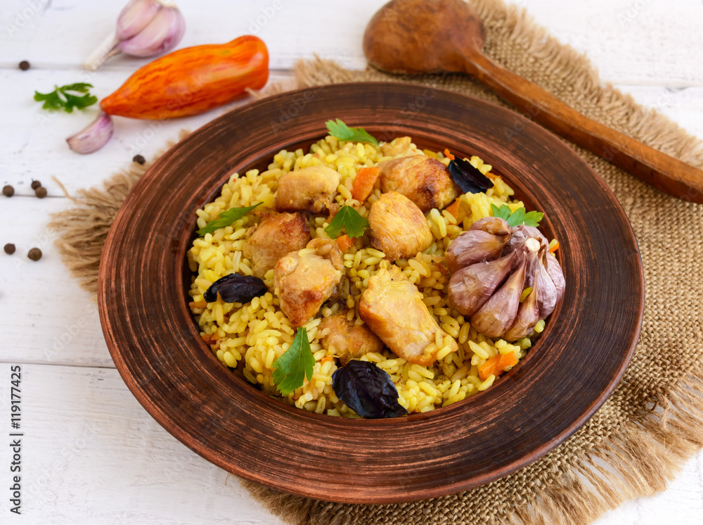 Boiled rice with roasted chicken, carrots, spices (traditional Asian dish - pilaf) Boiled rice with roasted chicken, carrots, spices (traditional Asian dish - pilaf)