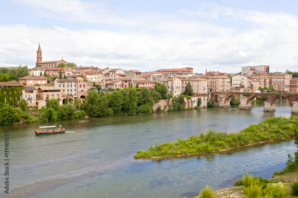 boat in Tarn river with a view of Albi, France