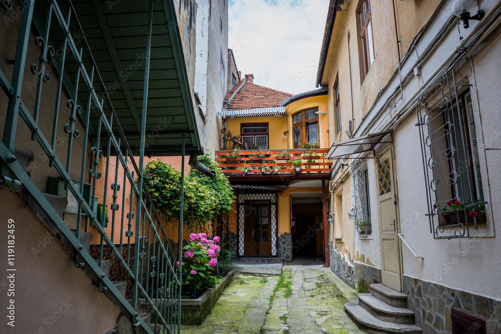Courtyard of small tenement houses in Brasov city in Romania