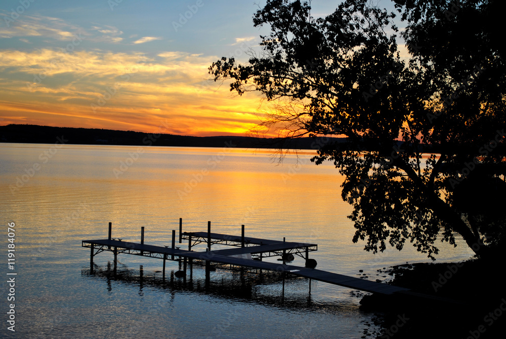 Colorful Summer Sunset of a Lake with a Small Boat Dock
