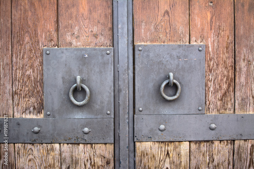 Canvas Print Wooden door with metal handlers