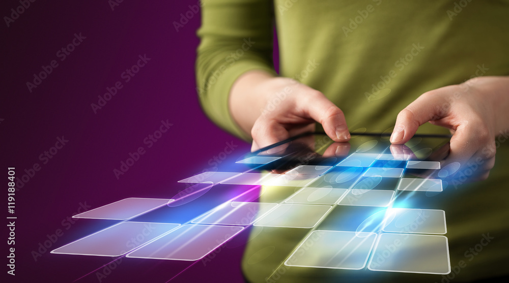 Close up of hand holding tablet with cyber application