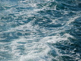 Deep sea foaming  surface background, close up