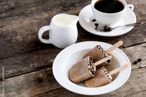 Homemade coffee popsicles and cup of coffee  photo