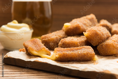 Delicious fried paneer cheese cubes on a plate.