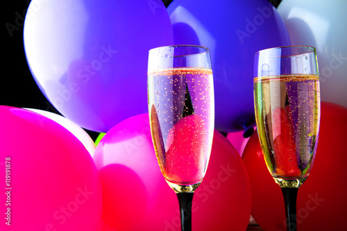 Two glasses of champagne and balloons on party