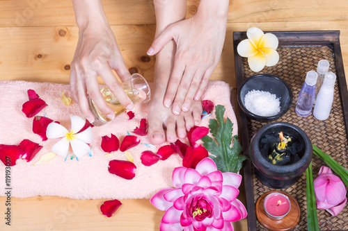 Closeup photo of a female hands and feet at spa salon