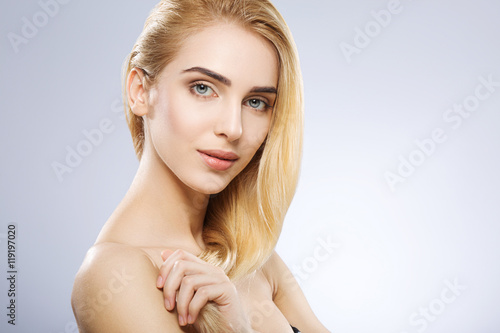 Portrait of girl with nude make up at studio