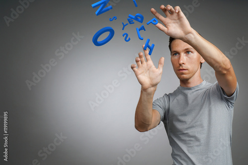 Man working with a set of letters, writing concept.