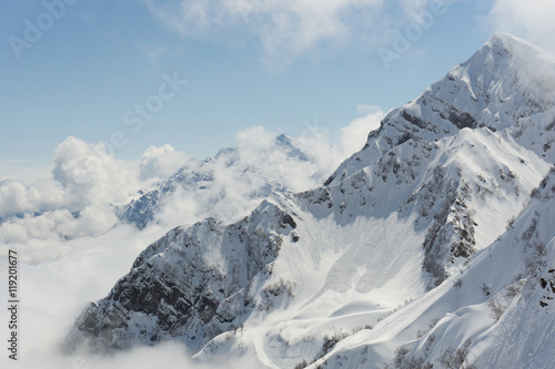 Winter mountain landscape and cloudy sky.