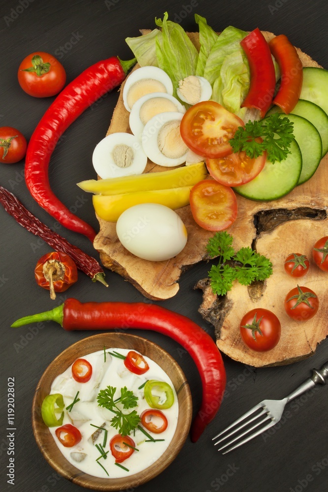 Fresh vegetables for snacks with dressing. Dip for vegetables. Healthy diet meal for dinner. Preparing vegetables in a home kitchen.
Fresh vegetables for snacks with dressing. Dip for vegetables. Healthy diet meal for dinner. Preparing vegetables in a home kitchen.