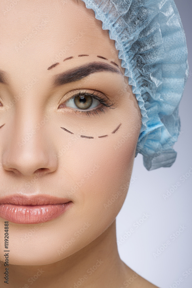 Girl in protective cap with lines around eyes Girl in protective cap with lines around eyes