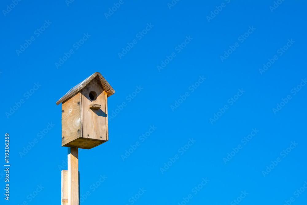 Nesting box on blue sky background
