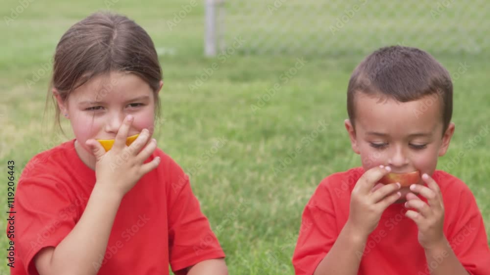 Children eating snacks after practice Children eating snacks after practice