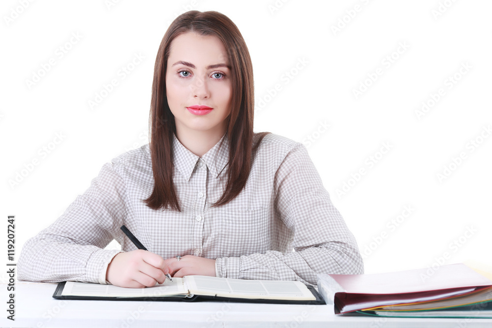 Charming young student girl holding exercise books Charming young student girl holding exercise books
